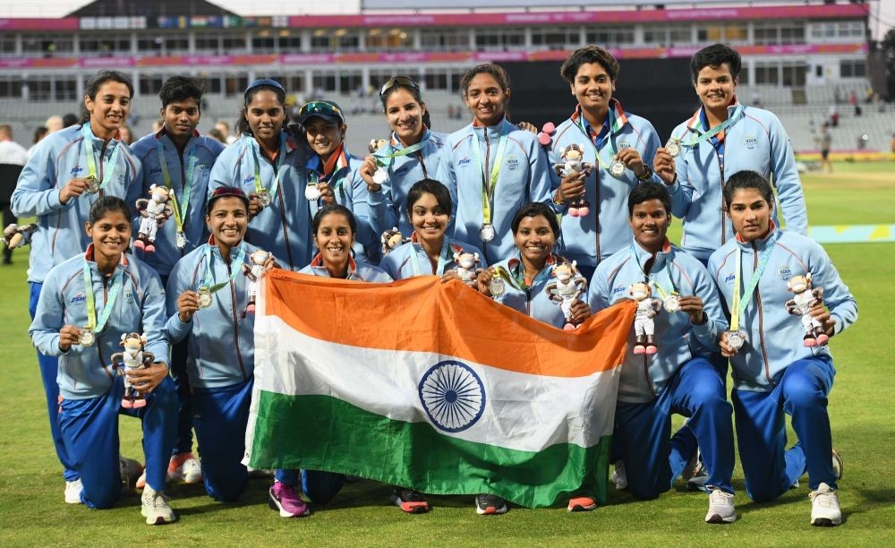 Birmingham:Silver medalist Indian Women Cricket team players,pose for photographs with Tricolor after the medal ceremony at Edgbaston at the Commonwealth Games in Birmingham, England, Sunday, Aug. 7, 2022.(Photo: Subir Halder/IANS)